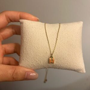 Letter H necklace in orange and gold chain